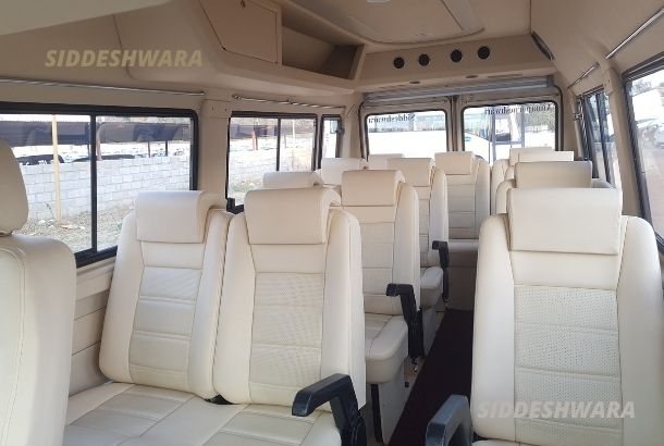 traveller bus price 12 seater on rent